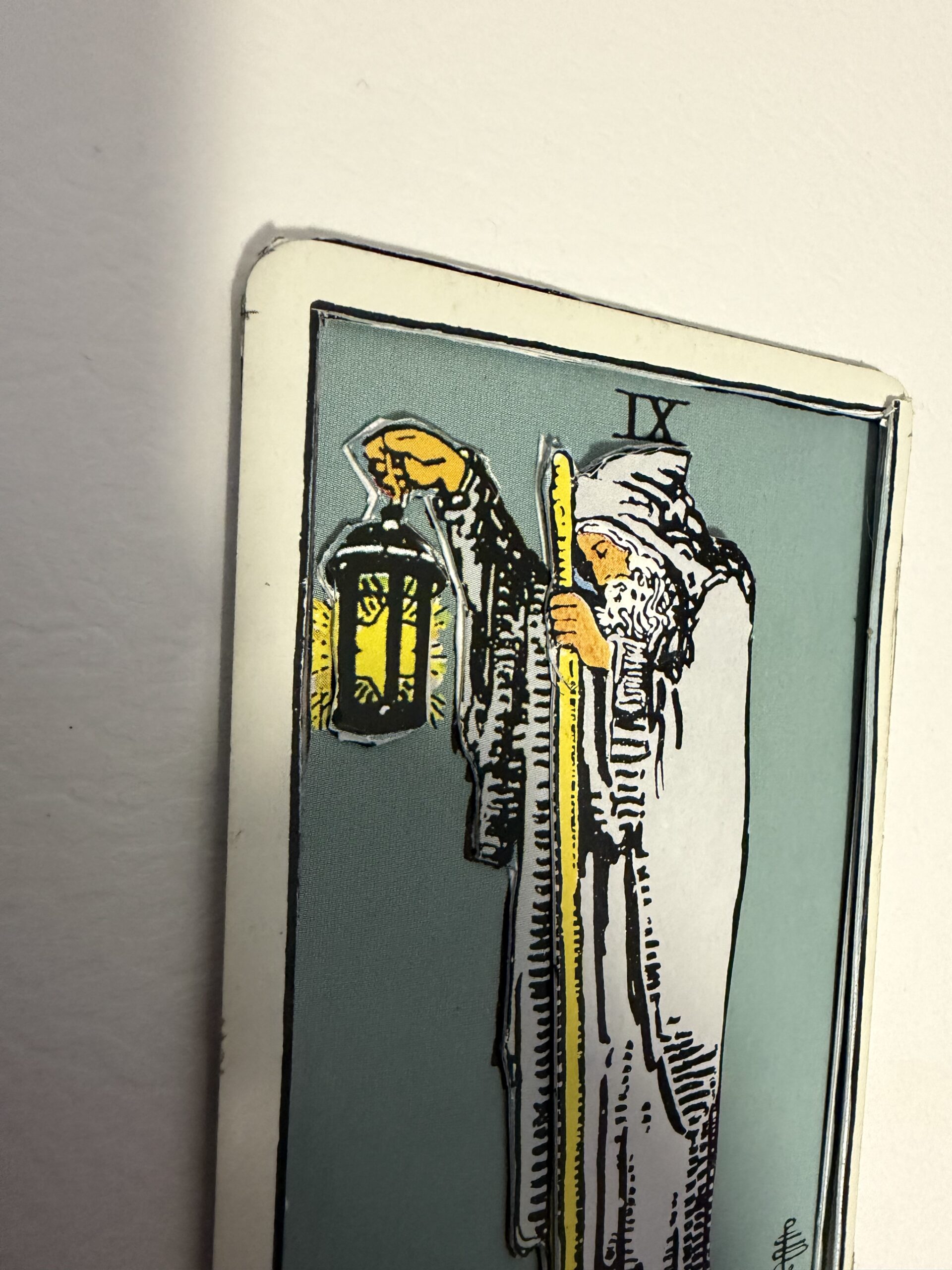 angled view of 3D layered Hermit tarot card showing depth and raised lantern