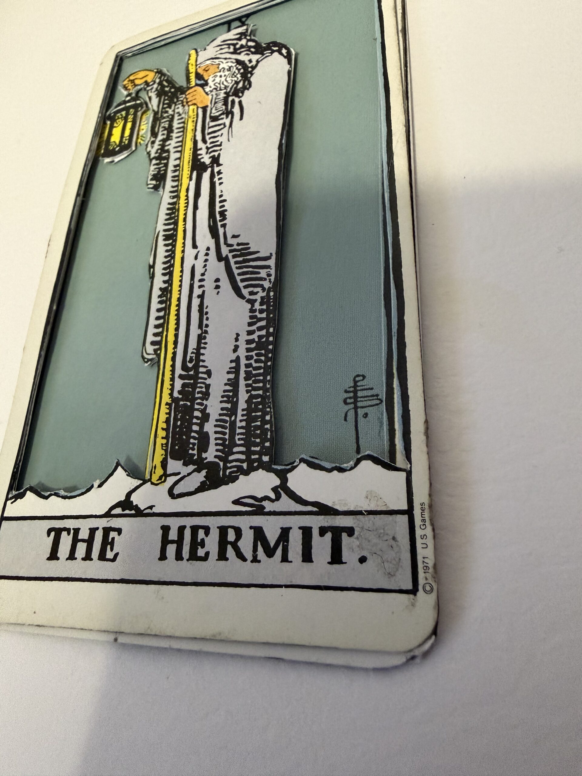 low angle view of 3D Hermit tarot card showing layered base and depth